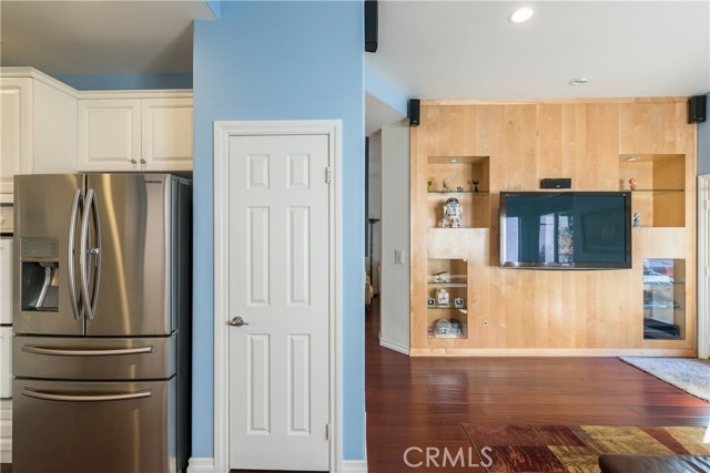 Pantry in Kitchen; Family Room w/ Custom Built-In Wall, Flat Screen TV & Surround Sound