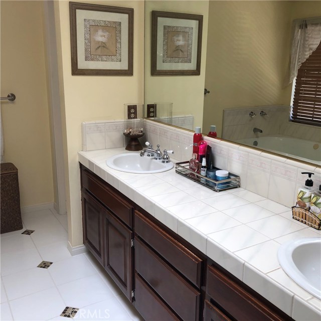Dual sinks in the master bath and a private toilet too!