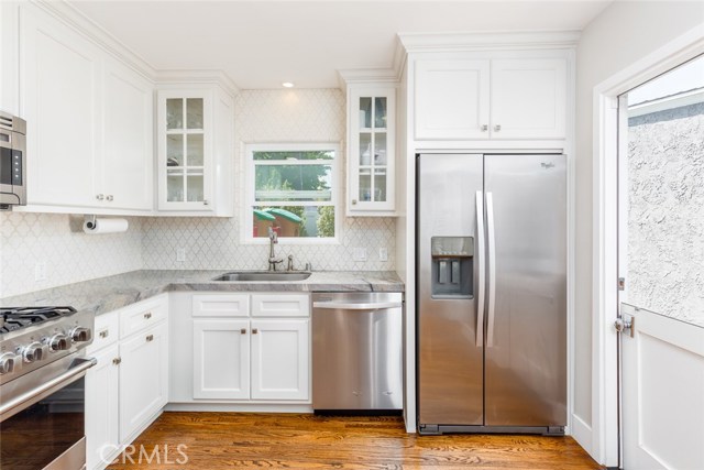 Viking stove, quartz counter tops, and a dutch door for breezy and casual living.