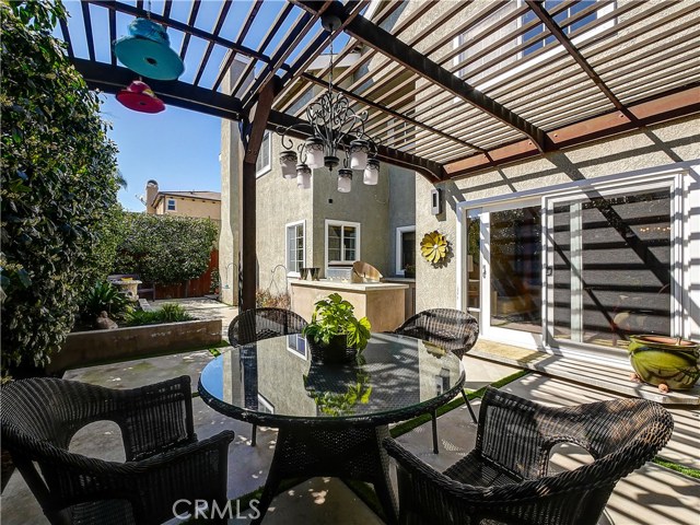 Outdoor dining under the exterior chandelier.