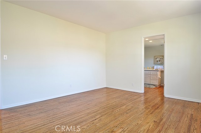 Spacious Bedroom Leading to Bathroom