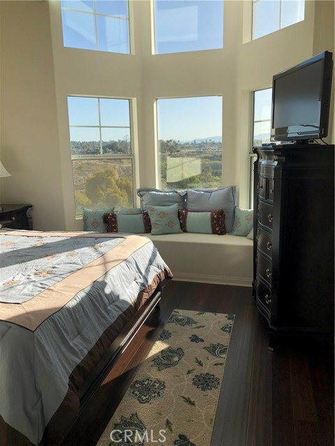 Master Bedroom featuring 16' ceiling and open space view