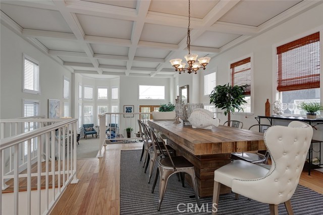 Dinning room with lots of natural light and custom window treatments.