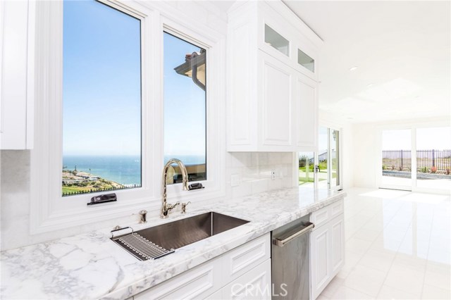 Kitchen sink overlooks entire ocean view