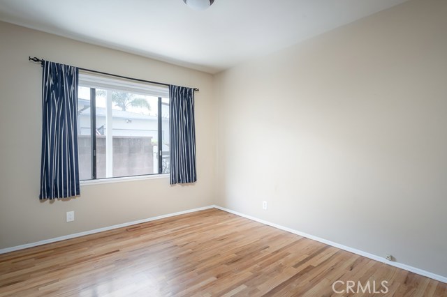 Second bedroom with gleaming wood floors