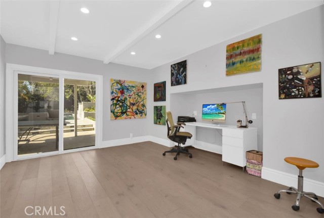 This room has so many uses... on the bottom floor... the big slider lets in copious light. Family room, home office away from the family, master bedroom ( again away from the kids rooms) You fill it with your needs!