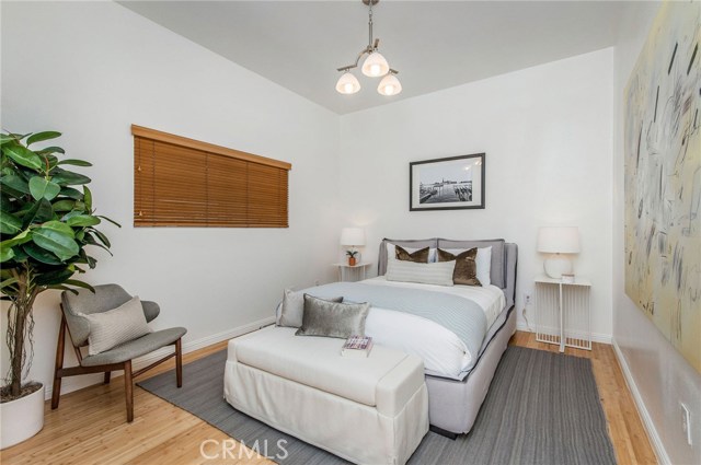 One of the two bedrooms on the entry floor.. close to the full bath. Those ceilings are nice and high.