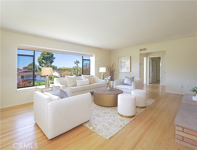 Another view of inviting living room with fireplace.