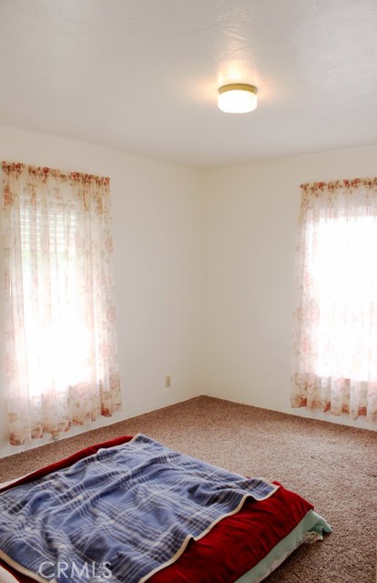 Bedroom 2 with two windows and cedar closet