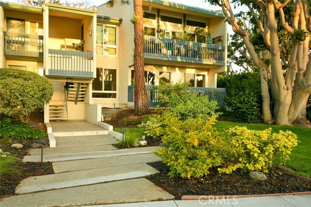 View of Exterior Condo Lower End Unit & Balcony