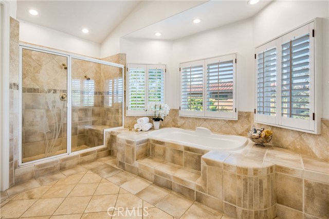 Plantation shutters let in light while still providing privacy as you indulge in a bubble bath.