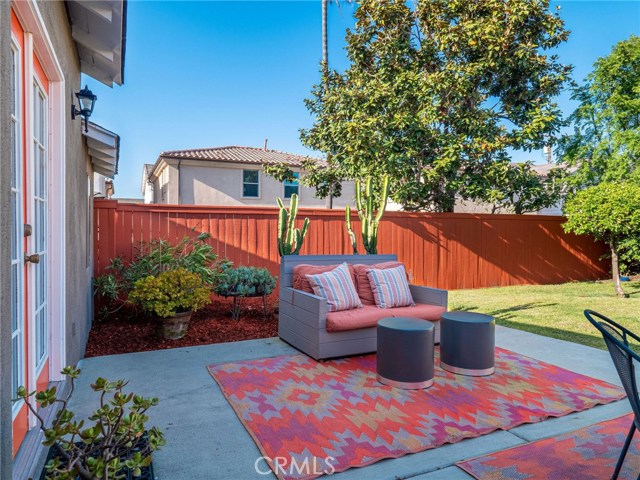Garden area behind outdoor living room.