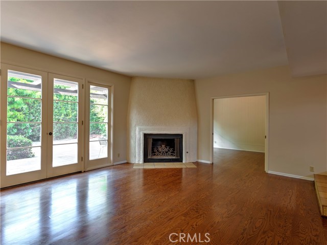 Living room w hardwood floors and fireplace