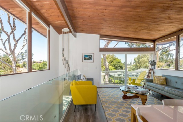 Another shot of living room and entry stairway... this home makes your heart sing!