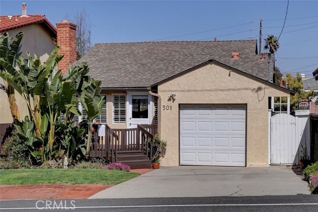 This charming beach bungalow has wonderful curb appeal and has plenty of parking on the brick pad for one or two cars, plus parking in front of the garage door.