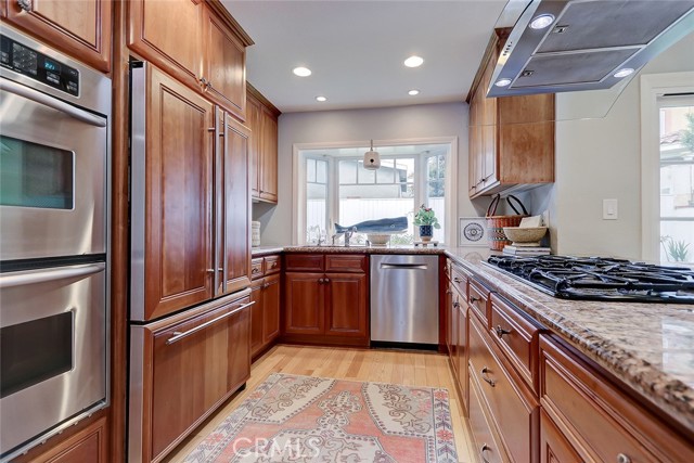 The kitchen features bar seating and a walk in pantry.