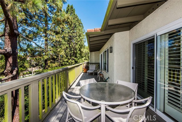 The upper balcony is very private and large enough for a bar-b-que and patio furniture. With convenient access from both the living room and the breakfast nook, it really is an extension of the living space. You're kept cool by mature trees.