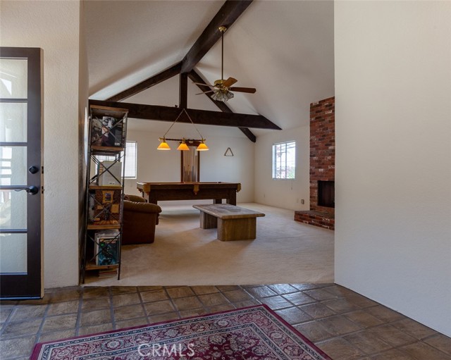 Large guest suite with cathedral ceilings, wood burning fireplace, and full bath