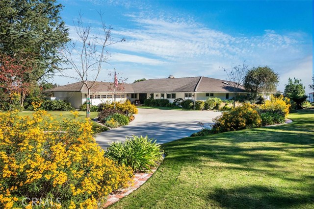 Set way back from the street via along driveway through the gorgeous landscaped grounds.