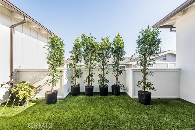 Custom Installed faux sod.  Keeps the area cool in the summers and usable in the cooler months!
