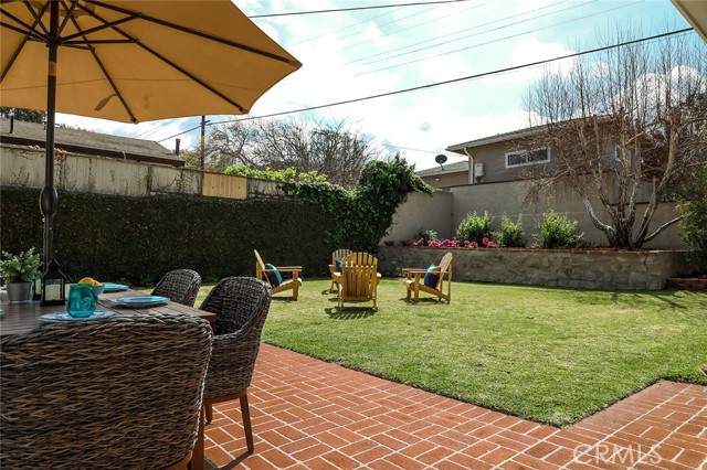 Large backyard with area for hanging out and kids to play