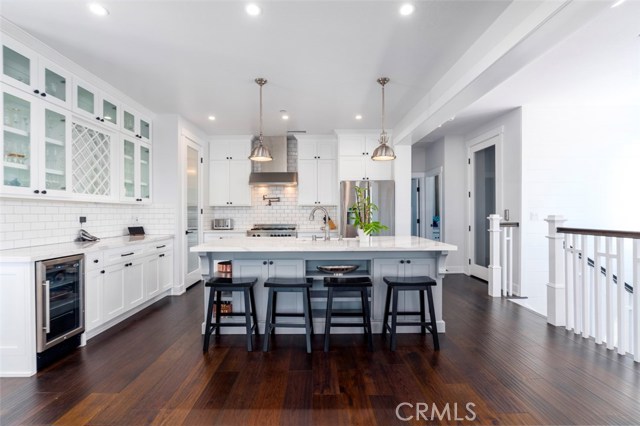 beyond kitchen is a powder room and an en-suite 4th bedroom