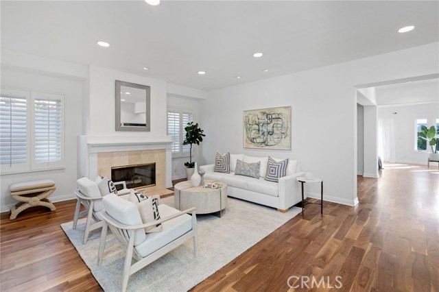 Formal Living Room with Wood Burning Fireplace, Wine Storage and Built-in Cabinetry/Shelving