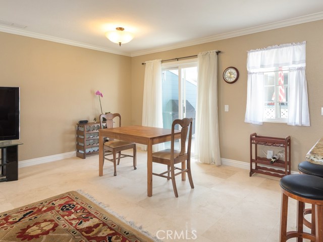 Another view of the dining area. Slider door leads to very large private balcony.