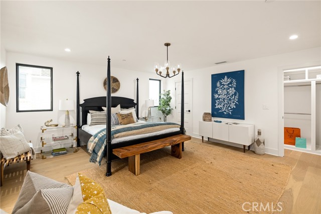 Generous Master Suite with His And Hers Closets - A Wall To Wall Corridor Closet And A Separate Walk-In Closet