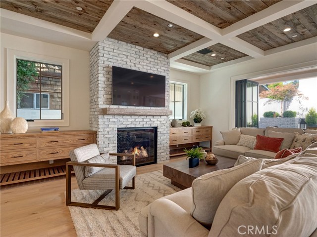 65" TV already installed, gas fireplace, Trestlewood reclaimed wood ceiling accents, white oak flooring, LaCantina door systems, built-in cabinetry, white washed brick fireplace, recessed lighting, whole home surround sound.