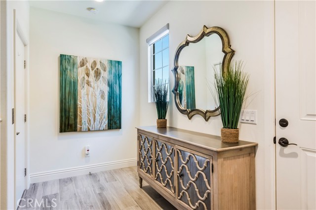 Entry off garage with elevator to living space, or stairs your choice. Wood tile flooring.