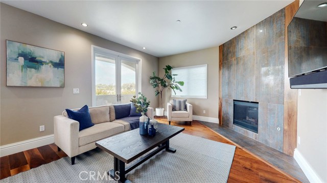 Upstairs Family Room, Double Doors take you to the Viewing Balcony. Natural Gas Fireplace with 