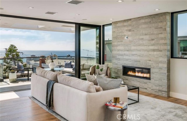 Enjoy a chic fireplace built into the stunning stone wall detail