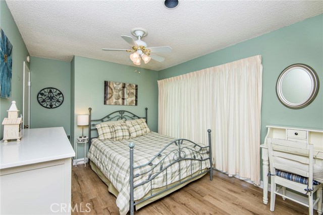 Bedroom #4 with sliding glass doors out to backyard Bedroom #4 with sliding glass doors out to backyard