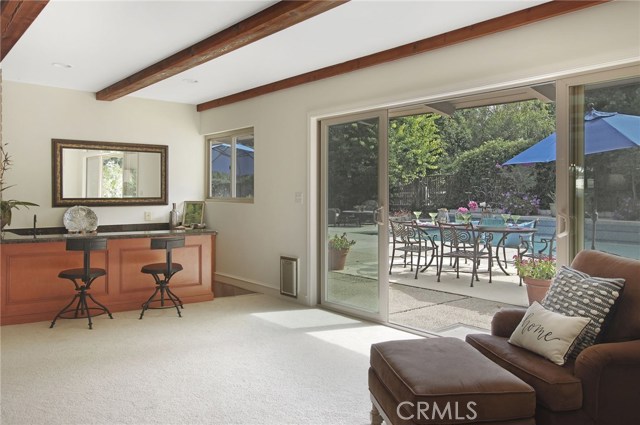 Family room open to private yard with generous, beautiful pool