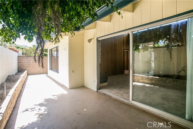 The real patio is accessed by the living room slider and the door off of the kitchen.