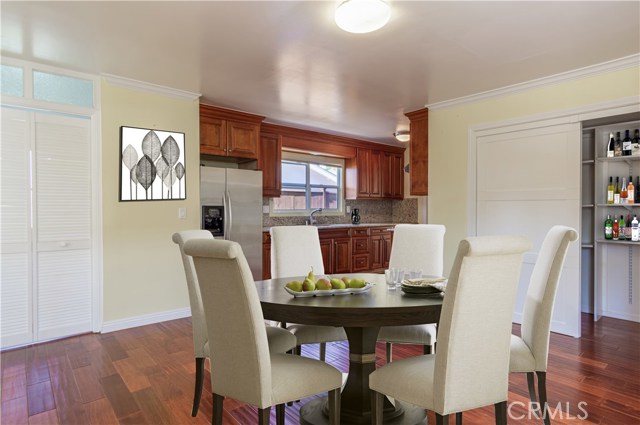 Virtually Staged Dining Area with view into Kitchen