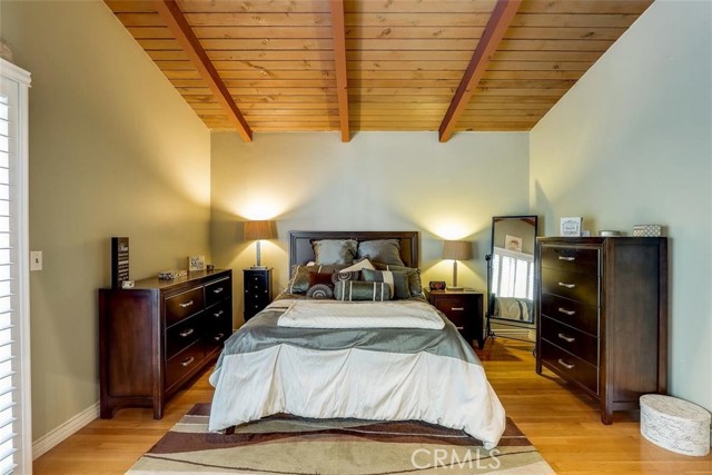 Primary Suite bedroom with private access to your back balcony overlooking your serene back yard.