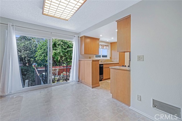 Dining Room overlooking Enclosed Patio, adjacent to Kitchen
