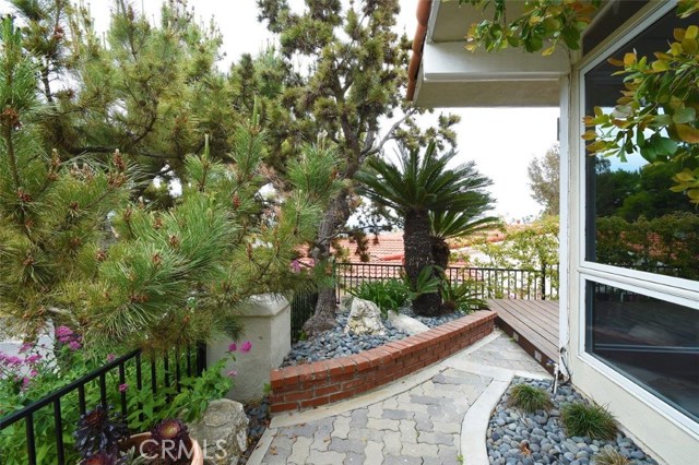 Front gated area with pavers and landscaping