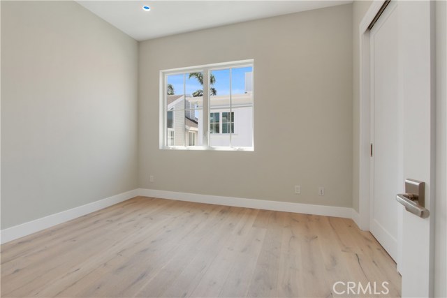 Imported Oak flooring  with molding , high ceilings and recessed lighting