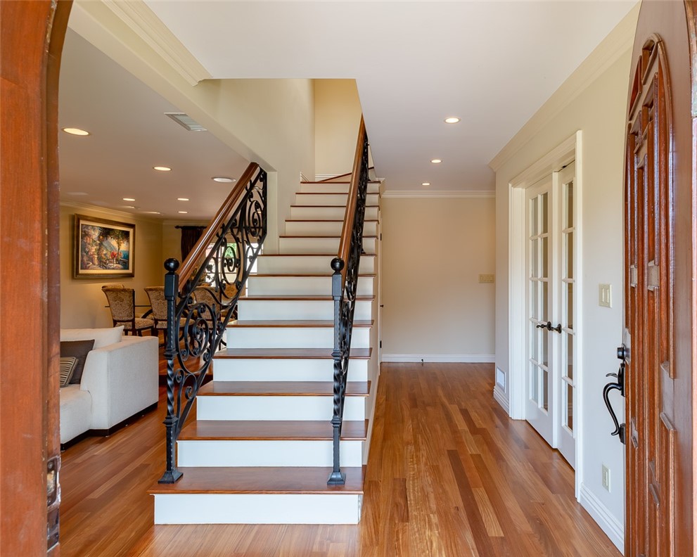 Front entrance.  Living room to the left.  French doors to right lead to office. Newly refurbished hardwood floors