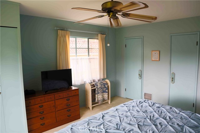 Main floor primary bedroom with double closets.