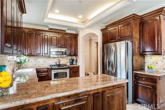 The kitchen also includes stainless appliances.
