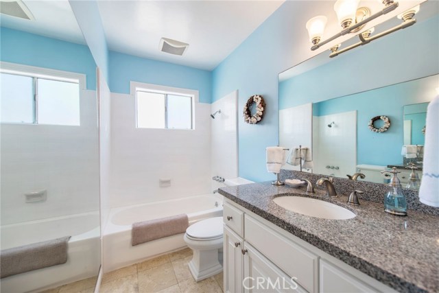 Upstairs bathroom with granite counters, tile flooring, new fixtures and a new shower door to be installed this week