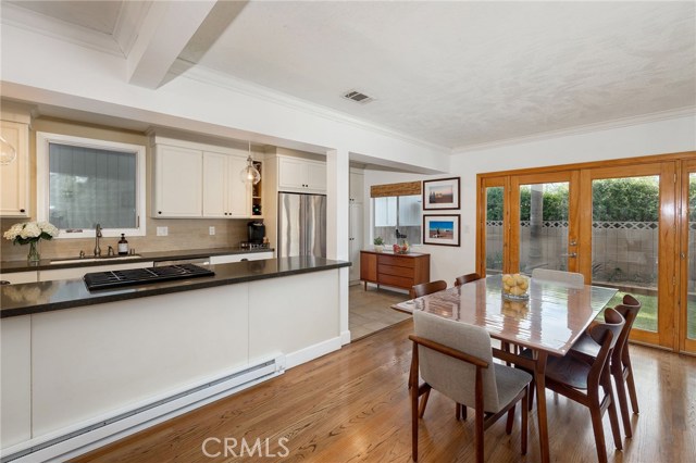 remodeled kitchen opens to dining room & backyard