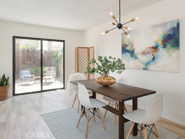 Dining area situated beside entrance to the backyard.  Makes it convenient for outdoor dining.