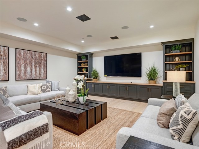 HUGE 1,557 sq. ft. entertainer's dream basement with full bar, dishwasher, ice maker, fridge, 86" TV already installed, surround sound, wired for Dolby Atmos 9.4.2 channel cinema, lounge area, half bath, downstairs bedroom suite.