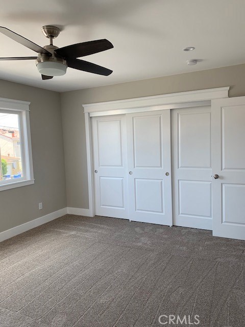 Upstairs bedroom two view of closet.