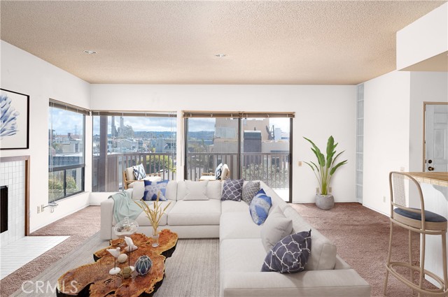 Living room - top floor with south facing balcony and lots of natural light (virtually staged)